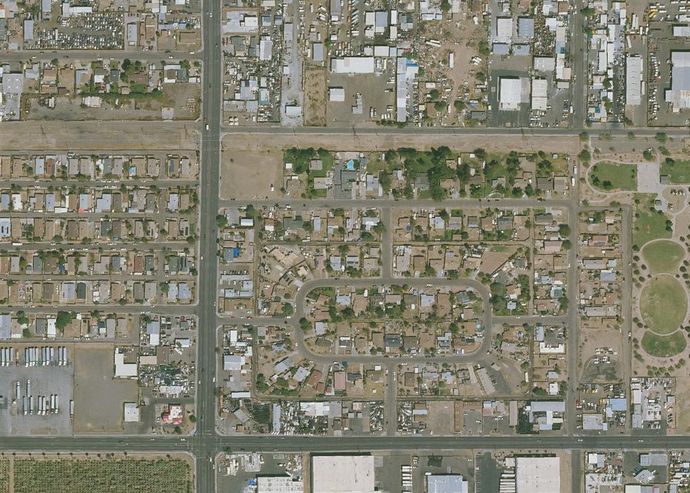 Satellite view of a Phoenix neighborhood at dawn - truck 7 parked in the driveway